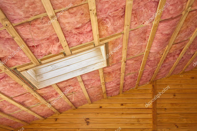 Pink Fiberglass Roof Insulation in Sloping Roof
